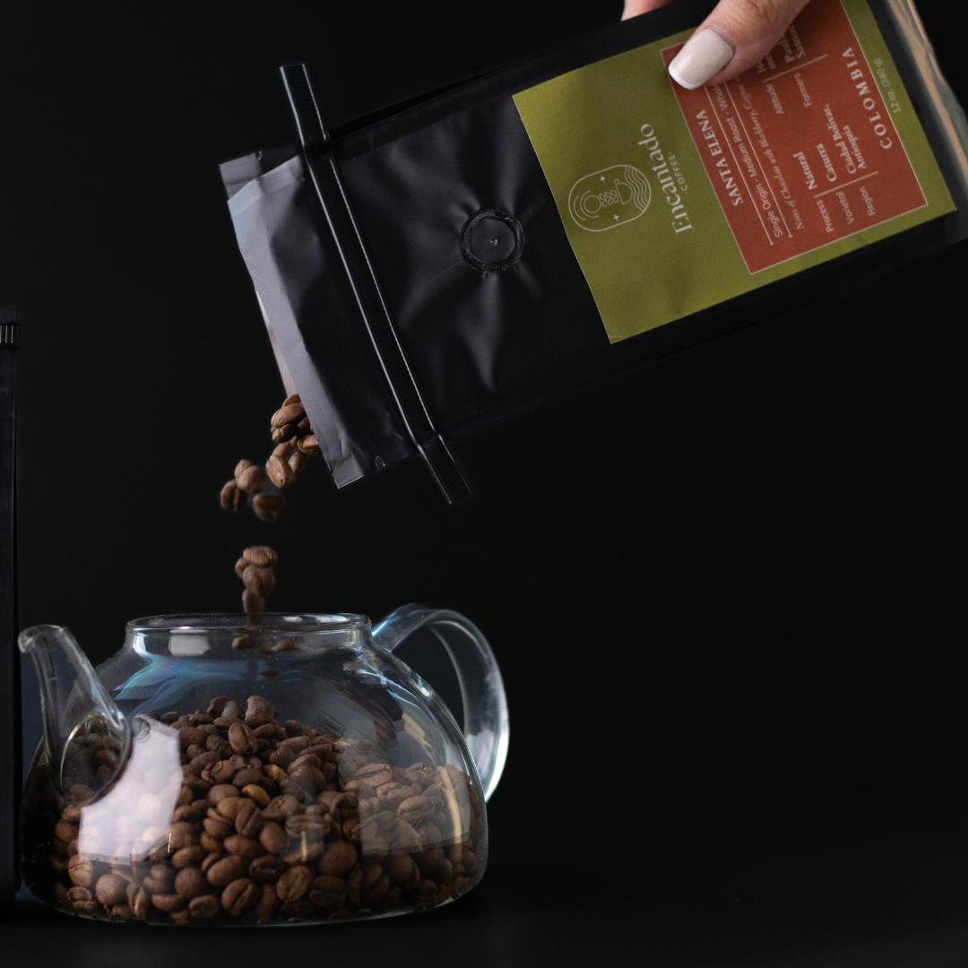 a bag of coffee pours coffee beans into a clear glass coffee pot