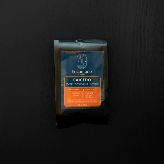Coffee package with 'Caicedo' branding on a black background