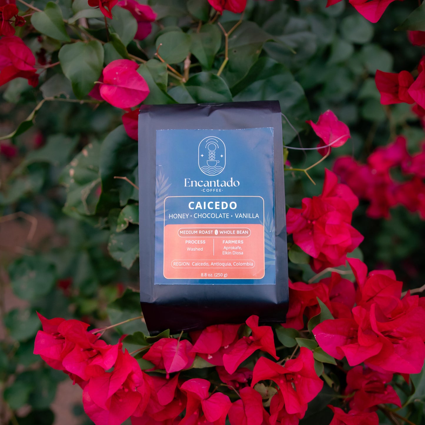 Encantado coffee package on a background of pink flowers