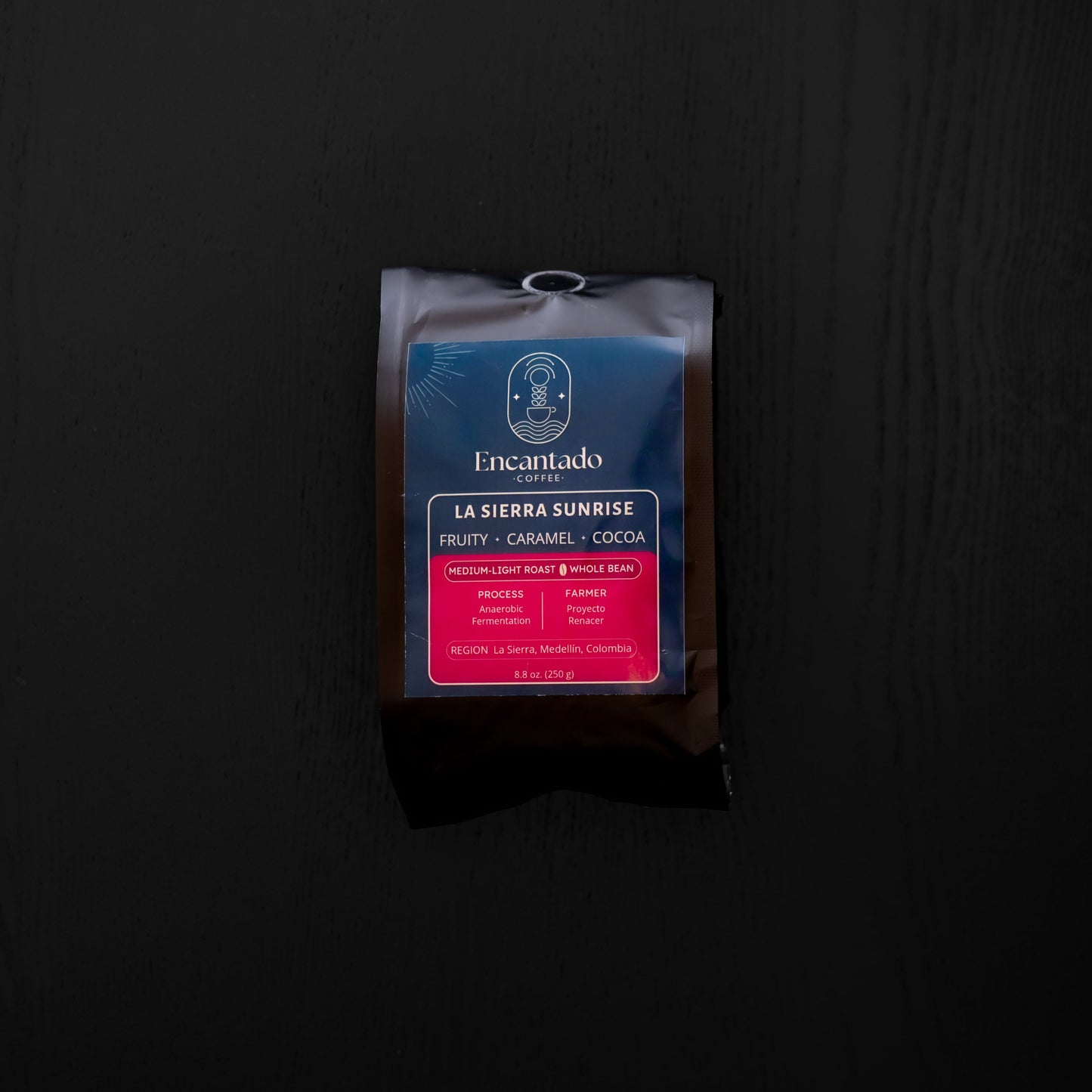 Coffee package labeled 'La Sierra Sunrise' on a dark background